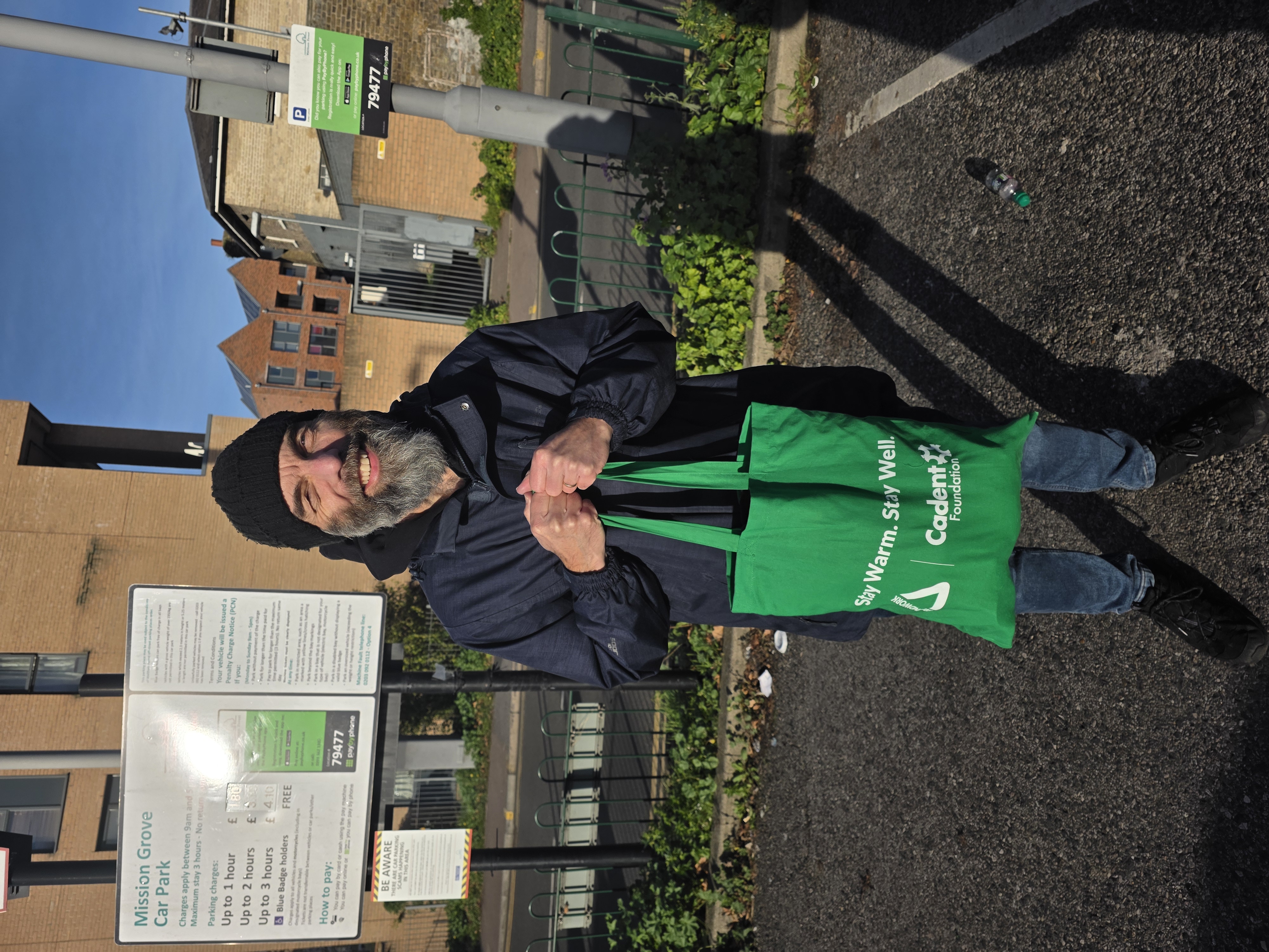 5K Steps & Snapshots participant holding Winter Warmer Pack provided by Groundwork London and Cadent Foundation
